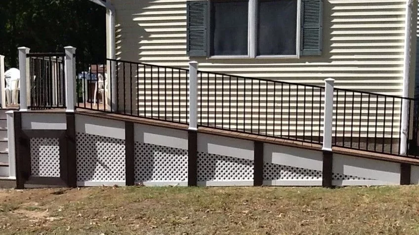 accessible porch and beautiful wooden wheelchair ramp addition to a manufactured home